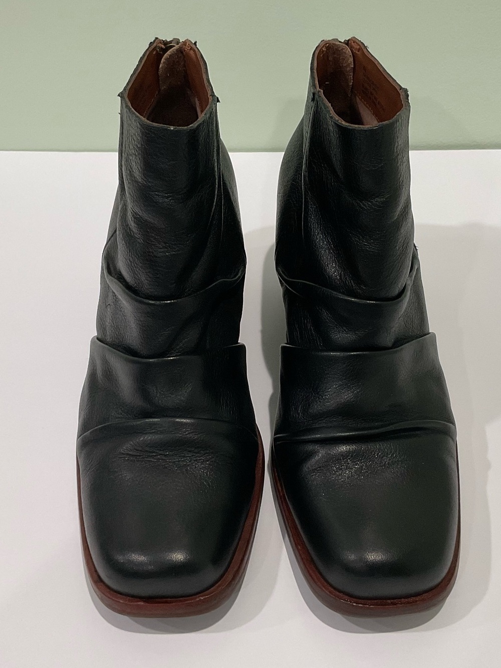 The image shows a pair of black leather Kork-Ease Kissel ankle booties.